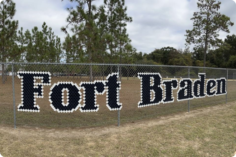 Fort Braden written out on a chain link fence